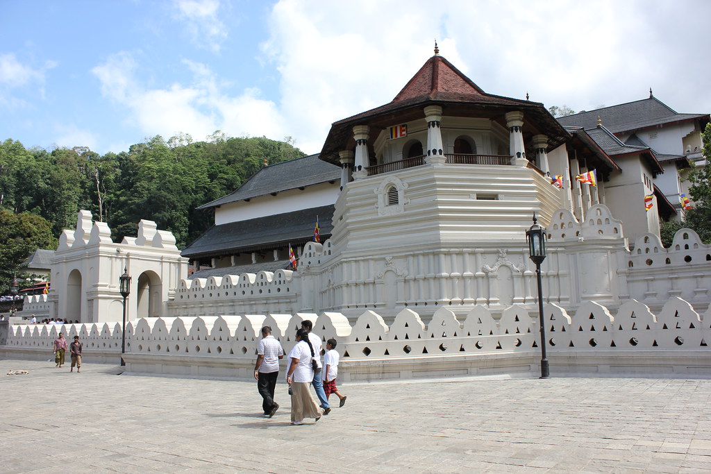 Pilgrims in white at the Temple of the Tooth