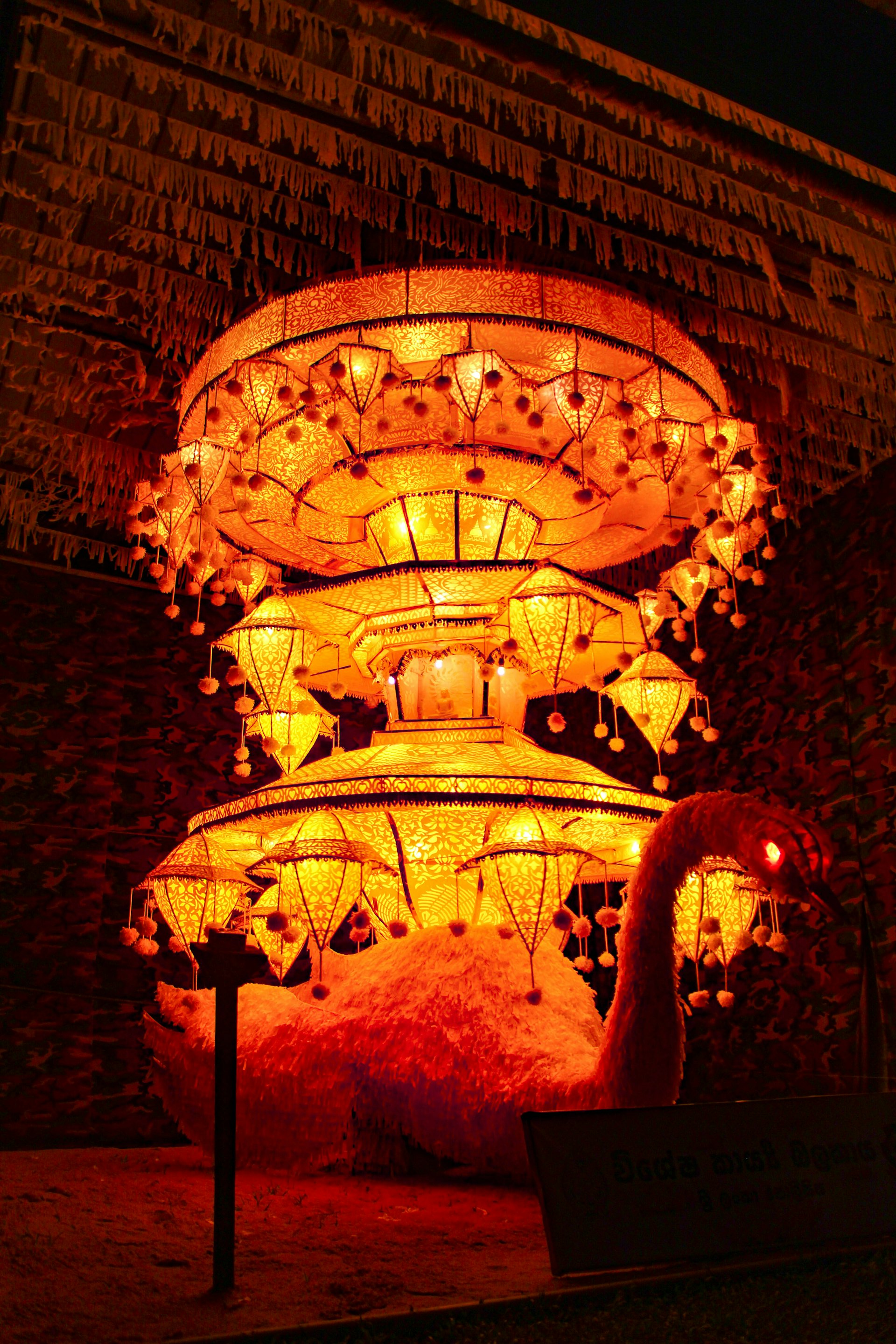 Lit festival display in front of a building